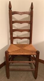 Ladder back chair with woven seat. Classic vintage chair.