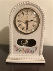 Porcelain vintage clock with old world appeal