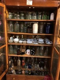 Vintage bottle collection along with marbles