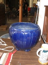 several pieces of art pottery