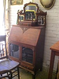 very ornate oak fall dront desk with mirrored eterge  top and vitrine base