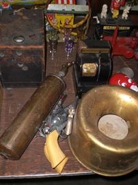 cap guns, brass fire extinguisher, brass cuspidor, etc.