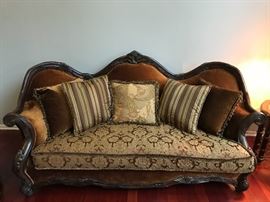 Essex Manor Sofa Michael Amini Upholstery: Deep Brown. Six throw pillows with trim. Single bench seat. Amazingly shaped hand carved frame. Beautiful shield back design. Construction material: Wood. Deep English Tea finish. Essex Manor collection. Leg Color: Deep English tea. Design: Standard. Overall: 45.25'' H x 92'' W x 40.25'' D