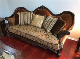 Essex Manor Sofa Michael Amini Upholstery: Deep Brown. Six throw pillows with trim. Single bench seat. Amazingly shaped hand carved frame. Beautiful shield back design. Construction material: Wood. Deep English Tea finish. Essex Manor collection. Leg Color: Deep English tea. Design: Standard. Overall: 45.25'' H x 92'' W x 40.25'' D