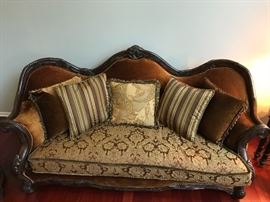 Essex Manor Sofa Michael Amini Upholstery: Deep Brown. Six throw pillows with trim. Single bench seat. Amazingly shaped hand carved frame. Beautiful shield back design. Construction material: Wood. Deep English Tea finish. Essex Manor collection. Leg Color: Deep English tea. Design: Standard. Overall: 45.25'' H x 92'' W x 40.25'' D