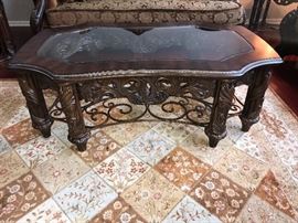 Michael Amini Essex Manor Traditional Rectangular Cocktail Table by AICO. The Essex manor rectangular cocktail table makes for an impressive addition to a living room with its intricate detailing and a deep English tea finish. An exquisite glass top defines the opulence of the piece, which is made from Birch solids for durability. Featuring floral moldings and fine carvings throughout, the table has gorgeous Birch and cherry veneers that add to its traditional aesthetics. Given the warm tone of the Essex manor rectangular cocktail table, it would easily blend in almost all kinds of traditional Decor styles.