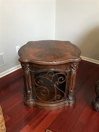 Michael Amini Essex Manor Traditional English Tea Barrel End Table by AICO. Show off your sophisticated taste with that Essex manor barrel end table, which is inspired from traditional European design ethos. Intricate detailing and soft, curved contours mark this gorgeous table, which would easily blend and most traditionally-styled decor themes. While the top of the table can be used for decorative purposes, the storage compartment with a glass shelf inside can be used for keeping your silverware and other items handy. Built to stand the test of time, the Essex manor barrel end table sports a deep English tea finish that emphasizes it’s ornate aesthetics. Constructed with Birch solids, Birch and cherry veneers. Intricate leaf wood carvings. Dark color tone. Barrel shaped end table.