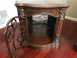 Michael Amini Essex Manor Traditional English Tea Barrel End Table by AICO. Show off your sophisticated taste with that Essex manor barrel end table, which is inspired from traditional European design ethos. Intricate detailing and soft, curved contours mark this gorgeous table, which would easily blend and most traditionally-styled decor themes. While the top of the table can be used for decorative purposes, the storage compartment with a glass shelf inside can be used for keeping your silverware and other items handy. Built to stand the test of time, the Essex manor barrel end table sports a deep English tea finish that emphasizes it’s ornate aesthetics. Constructed with Birch solids, Birch and cherry veneers. Intricate leaf wood carvings. Dark color tone. Barrel shaped end table.