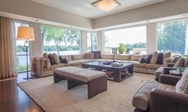 Baker Furniture oversized sectional sofa - three corner sections and five armless sections - custom fabric and custom down filled pillows with stripe fabric mitered on one side.  Baker Furniture ‘’Moderne’’ lounge chairs with Coco textured fabric on back and seat cushions.  Small round contemporary occasional table by Cumberland -  wood with chrome and leather accent.   Wood and leather ‘’Bannok’’ bench by Bernhardt designs.  Toja oversized wood coffee table - 64’’ L x 44’’ D x 18’’ H.  Double X sofa console table behind sectional - solid wood - 96’’ L x 20’’ D x 28 3/4’’ H