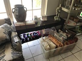 Console table, pottery, pillows and weights