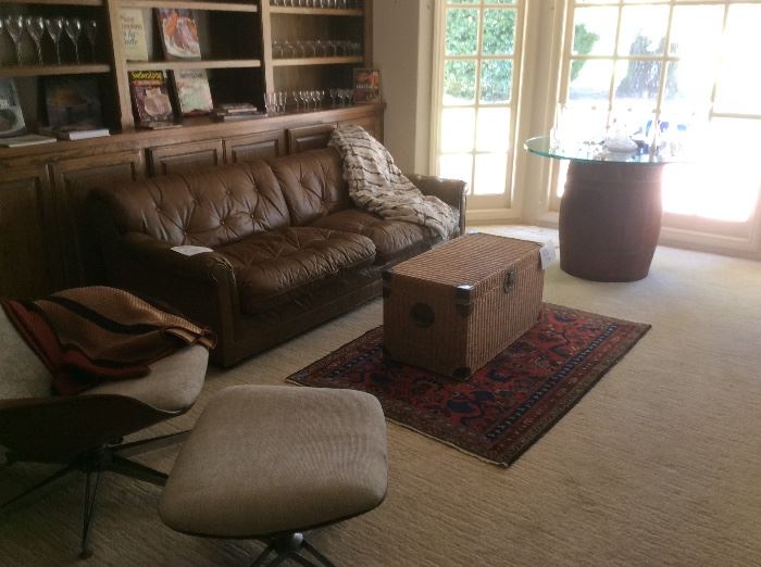 Leather sofa, wicker trunk, Persian rug, MCM CHAIR