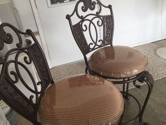 Two upholstered and metal bar stools