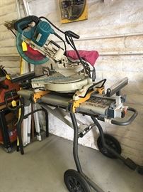 Makita 10in laser chop saw and a rigid miter saw on a rolling table