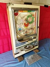 1960s Pachinko Arcade Game: http://www.ctonlineauctions.com/detail.asp?id=764501
