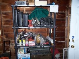 SHELF OF TOOLS IN GARAGE