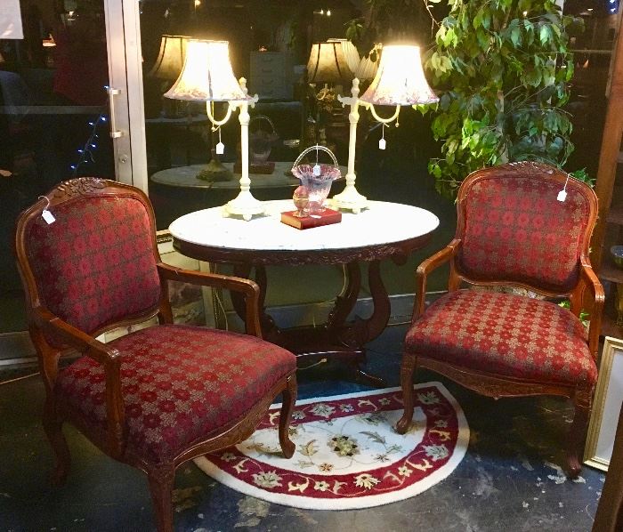 Pair of Burgandy and Gold Chairs with carved top and trim