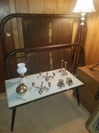 Full size iron bed, coffee table, brass, & milk glass small electric lamp.