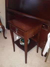 The full headboard/footboard has a matching nightstand, vanity, and chest of drawers.