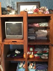 Inside the TV and Storage Cabinet.  Lots of Blankets, Quilts, Etc