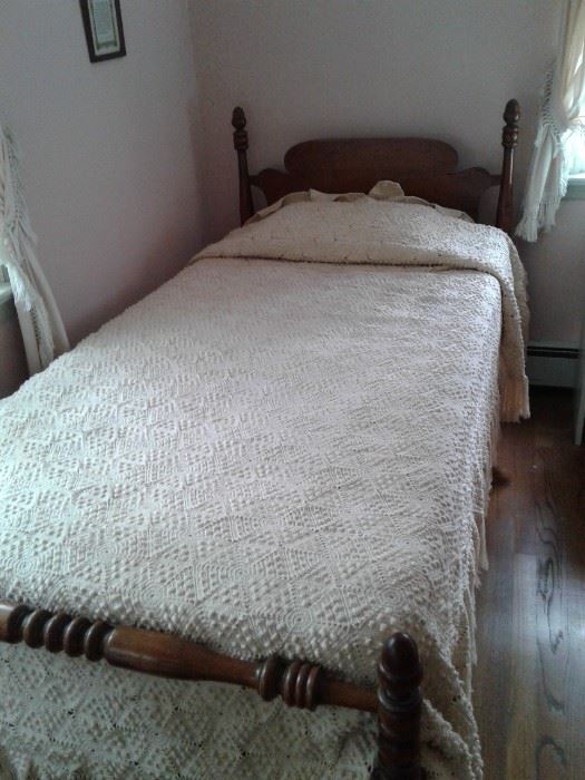 One of a pair of hand made bed covers 