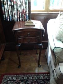 Pair of kidney shaped drop leaf side tables. Exceptional quality