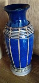 Beautiful blue ceramic vase  with straw accents
