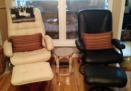 Comfy off white and black leather chairs with matching ottomans