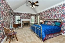 king size brass bed; small writing desk; windsor chair