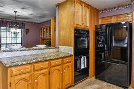 newer GE black refrigerator with freezer on the bottom