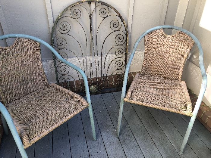 all-season wicker chairs and iron art for patio