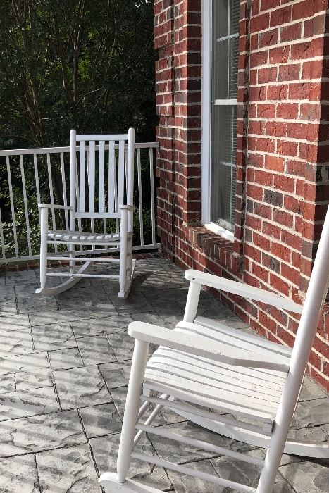 Pair of white outdoor patio wooden rocking chairs