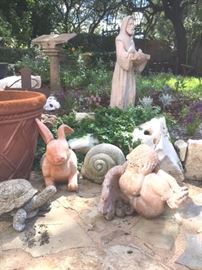 Numerous whimsical concrete and clay animals, reptiles, cherubs and St. Francis