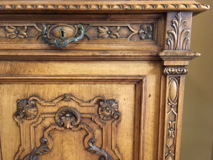 Detail of modern, heavily carved buffet.