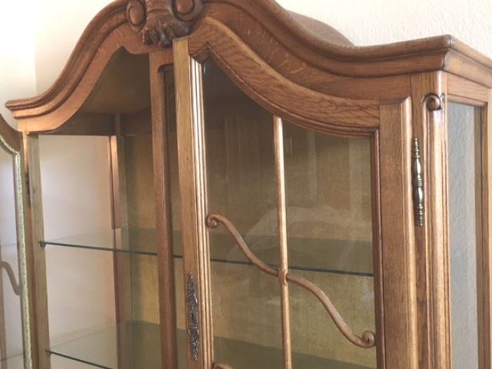 Detail of modern china cabinet with glass doors and shelves