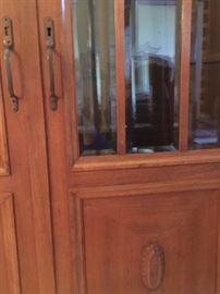 Detail of vintage china cabinet with glass doors