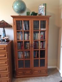 Glass front office cabinet in teak; matches a pair of filing cabinets and office desk