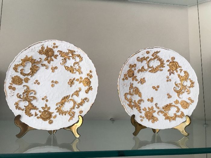 Meissen plates, in white heavy relief with gilt, as pair.