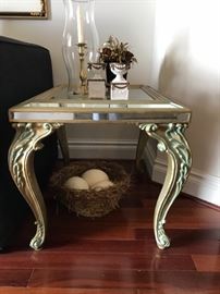 Mirrored and foliate motif endtables, pair with ostrich eggs in nest.