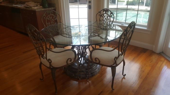 Round glass top table with 4 upholstered chairs!
$145