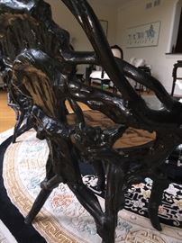 A Set of Four Black Carved Wood Root Chairs with Hand Painted Seat and Back. Chair Height: 34 inches. Seat Height: 18 inches x Width: 23 inches. In very good condition.