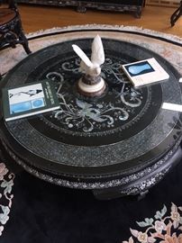 An Asian Round Coffee Table with Mother-of-Pearl inlays. Height: 31 x Diameter 15.5 inches. In excellent condition.