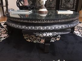 An Asian Round Coffee Table with Mother-of-Pearl inlays. Height: 31 x Diameter 15.5 inches. In excellent condition.