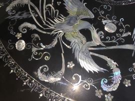 An Asian Round Coffee Table with Mother-of-Pearl inlays. Height: 31 x Diameter 15.5 inches. In excellent condition.