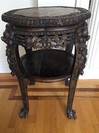 A Pair of Antique Chinese Wood Carved Tables with Marble Tops: Height 32 x Diameter 22 inches. In very good condition.