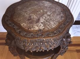 A Pair of Antique Chinese Wood Carved Tables with Marble Tops: Height 32 x Diameter 22 inches. In very good condition.