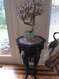A Chinese Antique Eight-Sided Marble Top Carved Wood Table: Height 34 x Diameter 20 inches. In very good condition.