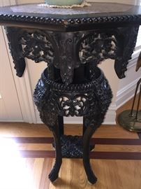 A Chinese Antique Eight-Sided Marble Top Carved Wood Table: Height 34 x Diameter 20 inches. In very good condition.