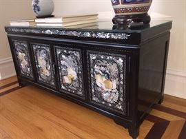 A Pair of Black Laquered with Inlaid Mother-of-Pearl Rectangular Asian Chests: Four doors and four drawers. Height 18 x Width 40 x Depth 14.5 inches. In excellent condition.