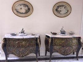 A Pair of Louis XV Style Marble Top Bombe Chests/Commodes/Console Tables. Hand painted floral design and gold gilt mounts. In excellent condition. Height 33.5 x Width 45.5 x Depth 20.5 inches.