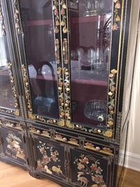 A Two-Piece Asian Black Lacquered Stone Inlayed China Cabinet/Breakfront. Four doors, six drawers and three shelves. Height 72 x Width 60 x Depth 19 inches. In excellent condition.